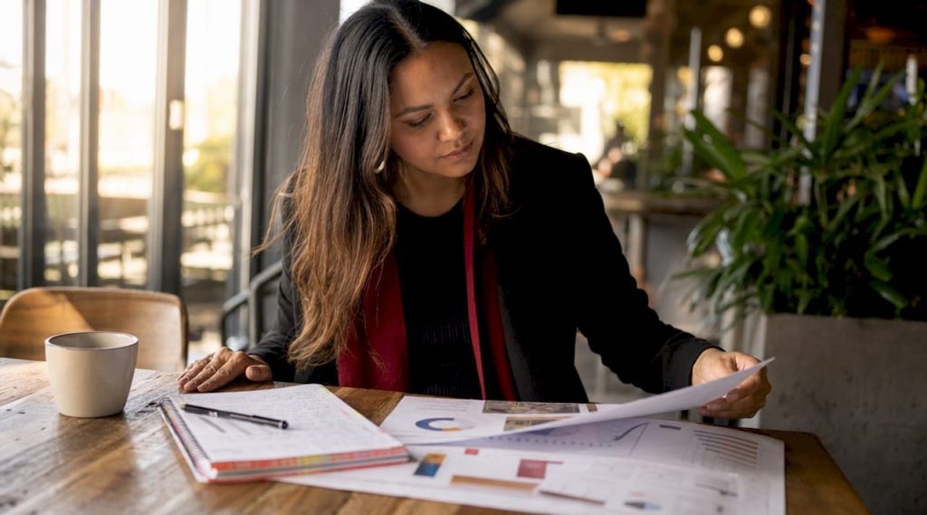 Marketing manager reviewing local Google Ads report