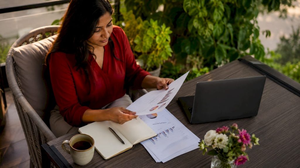 Businesswoman reviewing website scalability reports